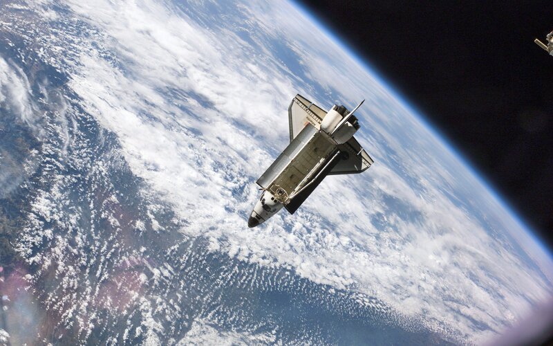 Space Shuttle in Orbit — Blue, Dramatic, Photograph, Earth, Clouds