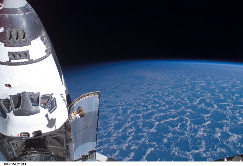 Space Shuttle in Orbit — Blue, Serene, Photograph, Earth, Clouds, White, Black, Iss015e21944