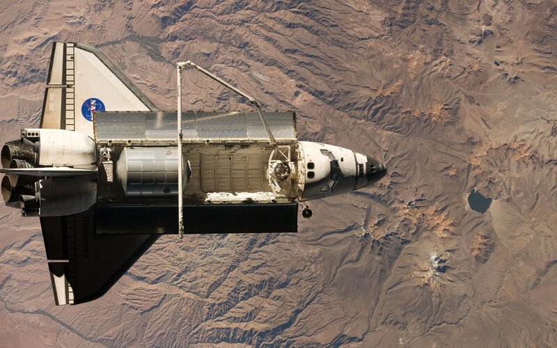 Space Shuttle in Orbit — Brown, Dramatic, Photograph