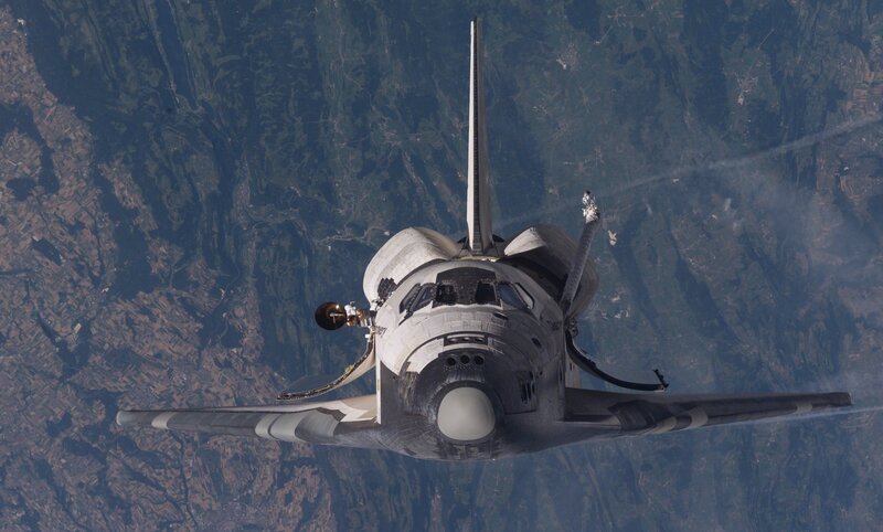 Space Shuttle in Orbit — White, Dramatic, Photograph, Earth, Atmosphere, Spacecraft