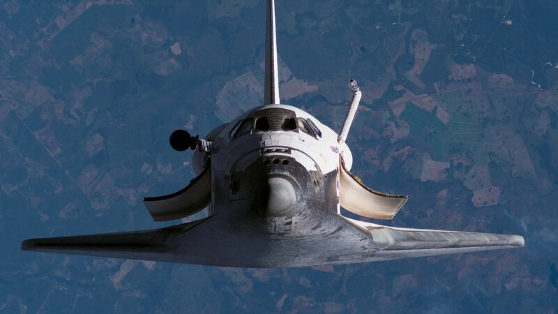 Space Shuttle in Orbit — White, Dramatic, Photograph, Earth, Atmosphere, Wings
