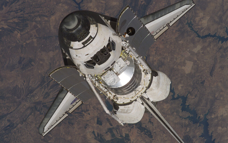 Space Shuttle in Orbit — White, Dramatic, Photograph, Earth, Spacecraft