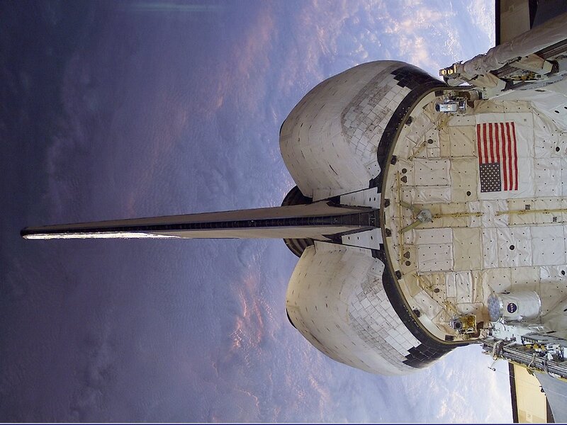 Space Shuttle in Orbit — White, Dramatic, Sunset
