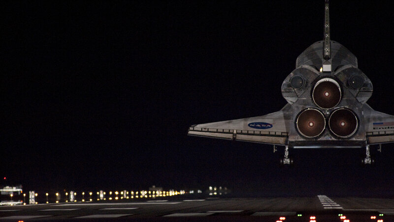 Space shuttle landing at night