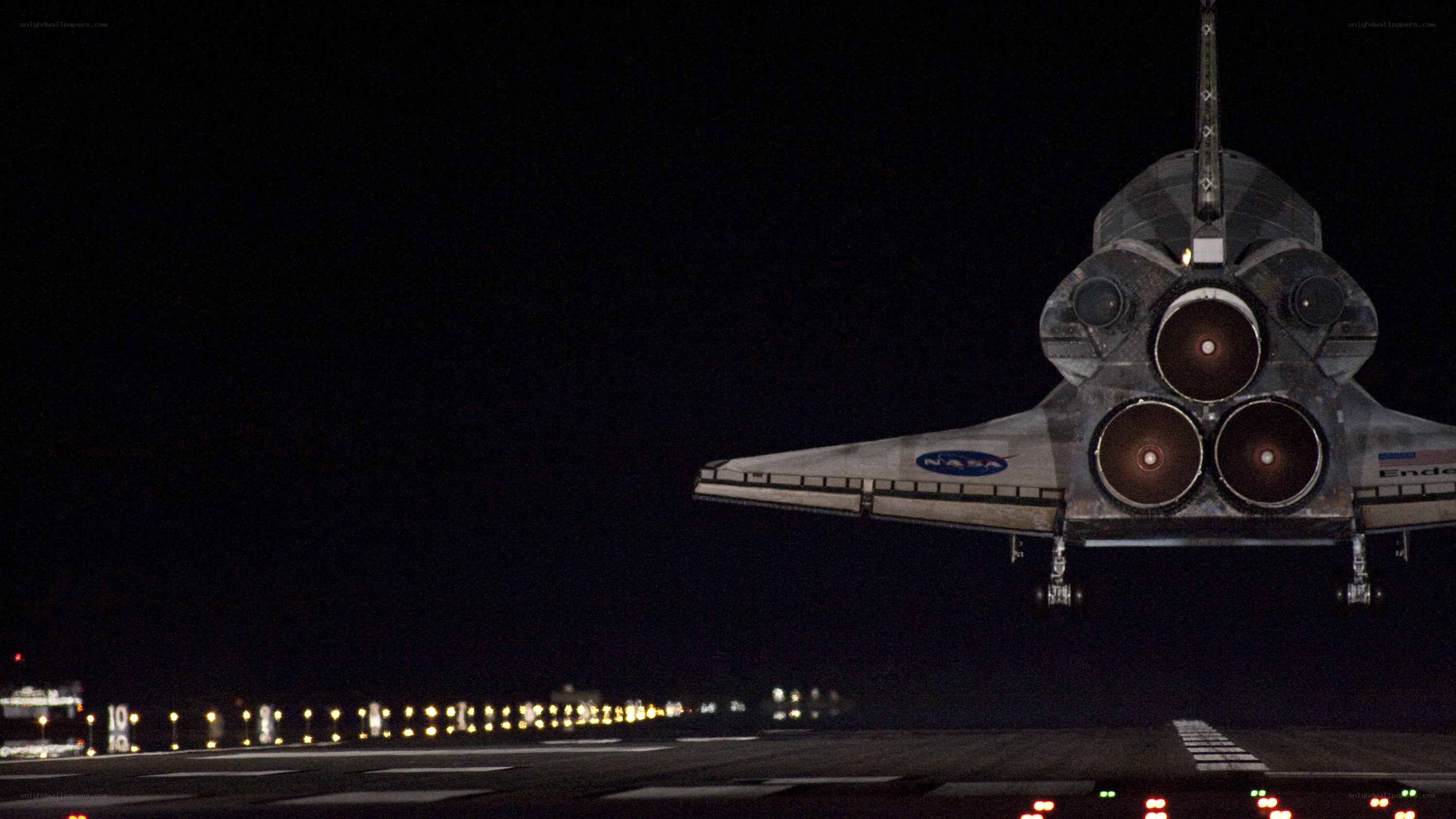 Space shuttle landing at night