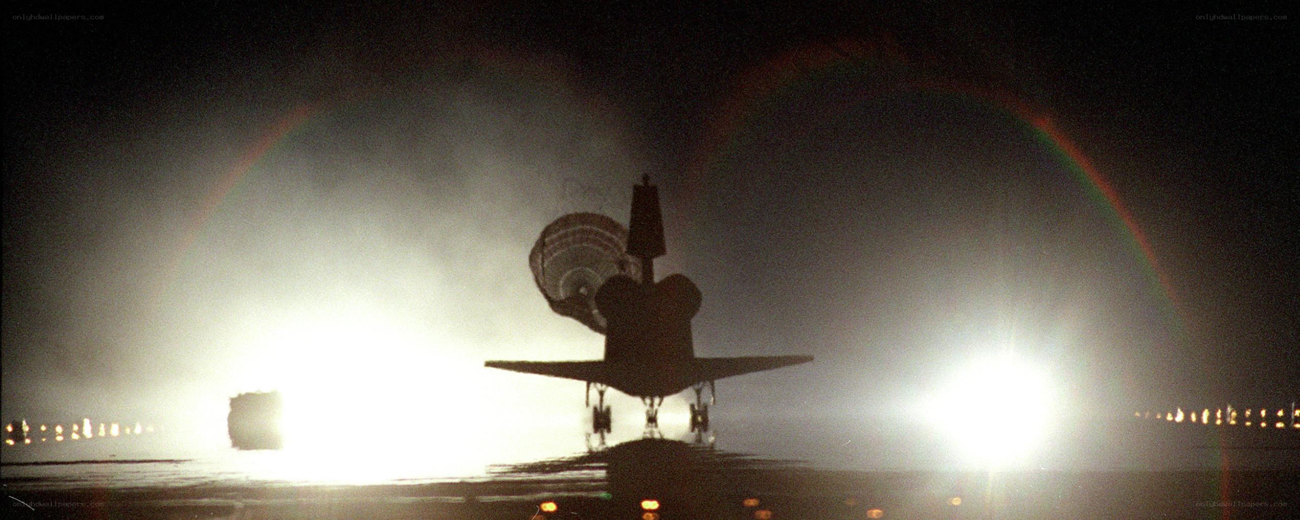 space shuttle landing at night