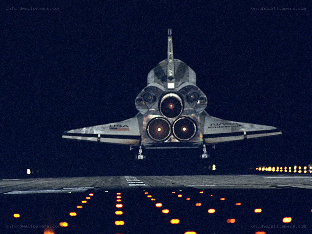 Space shuttle landing at night