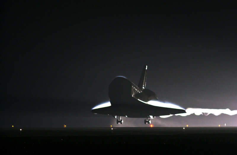 Space shuttle landing at night