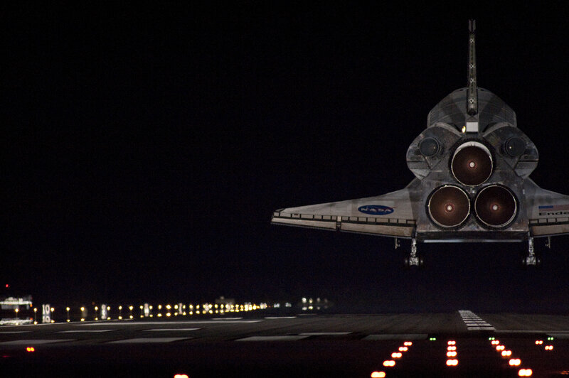 Space shuttle landing at night