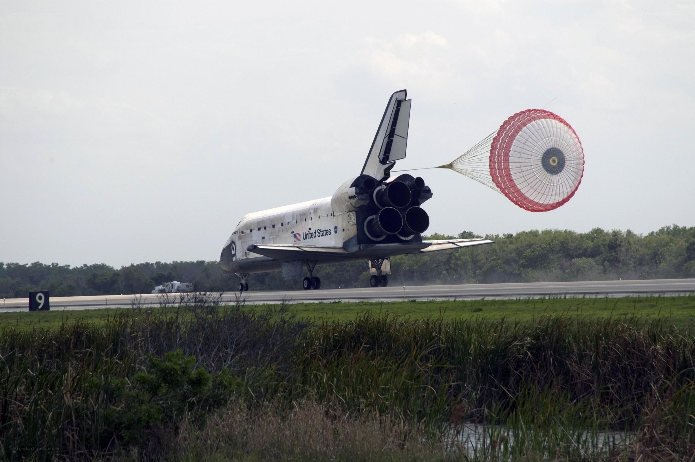 Space shuttle landing with parachute
