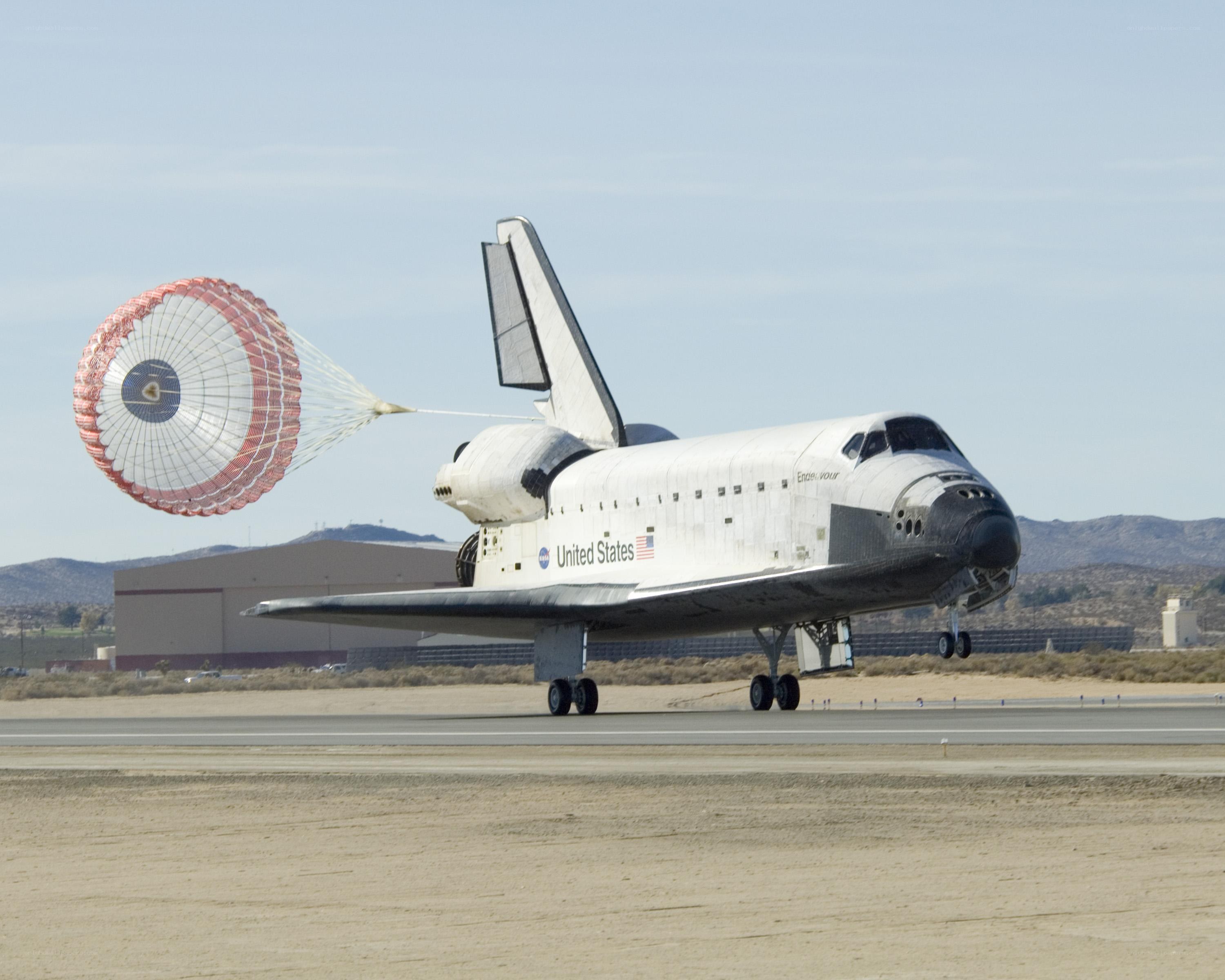 Space shuttle landing with parachute
