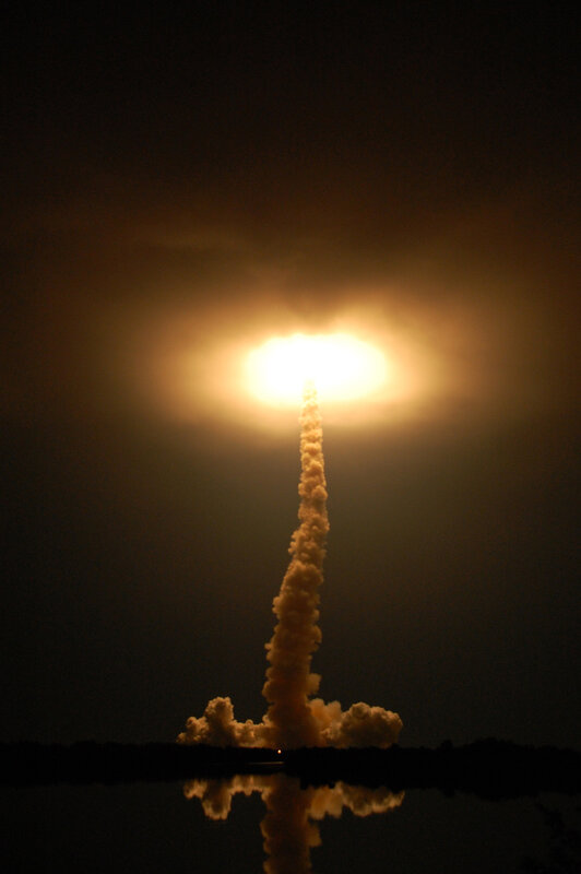 Space shuttle launch at night