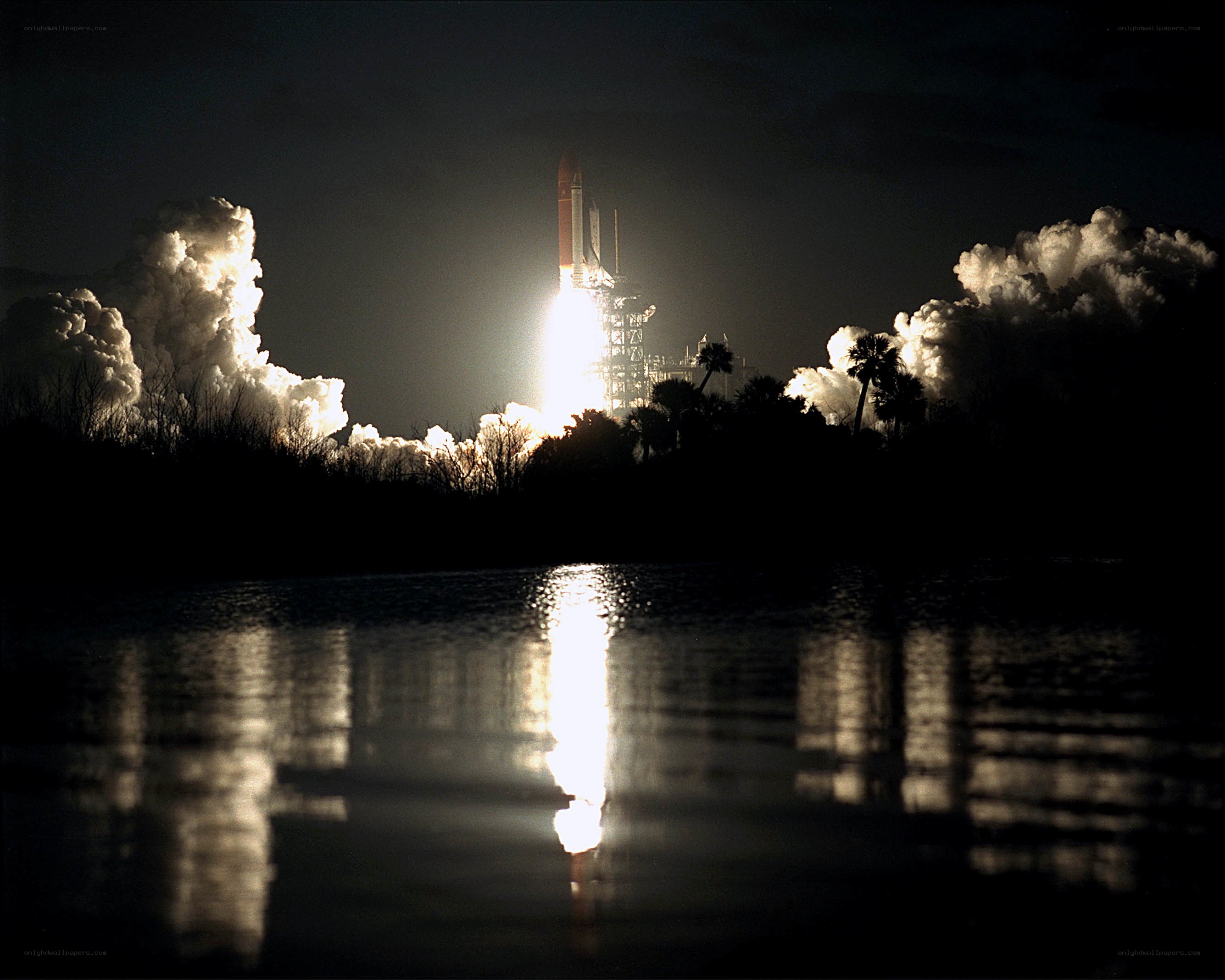 Space shuttle launch at night