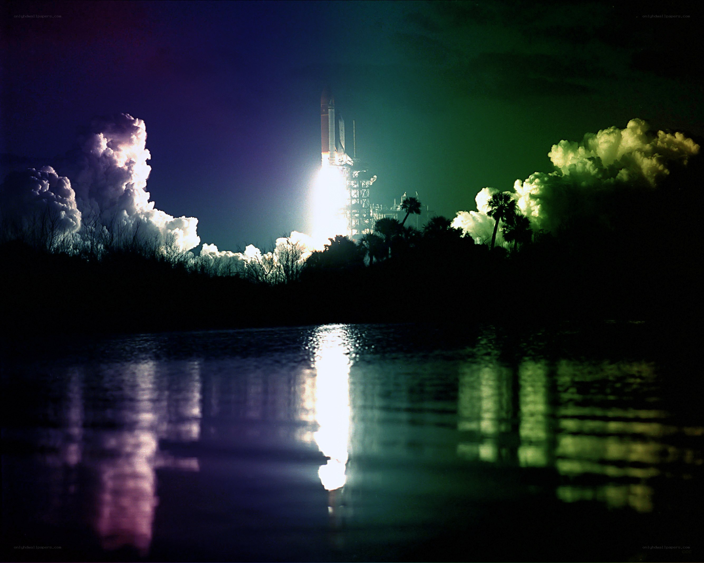 Space shuttle launch at night