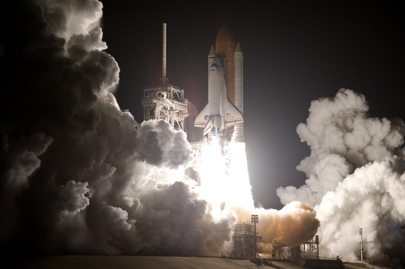 Space shuttle launch at night