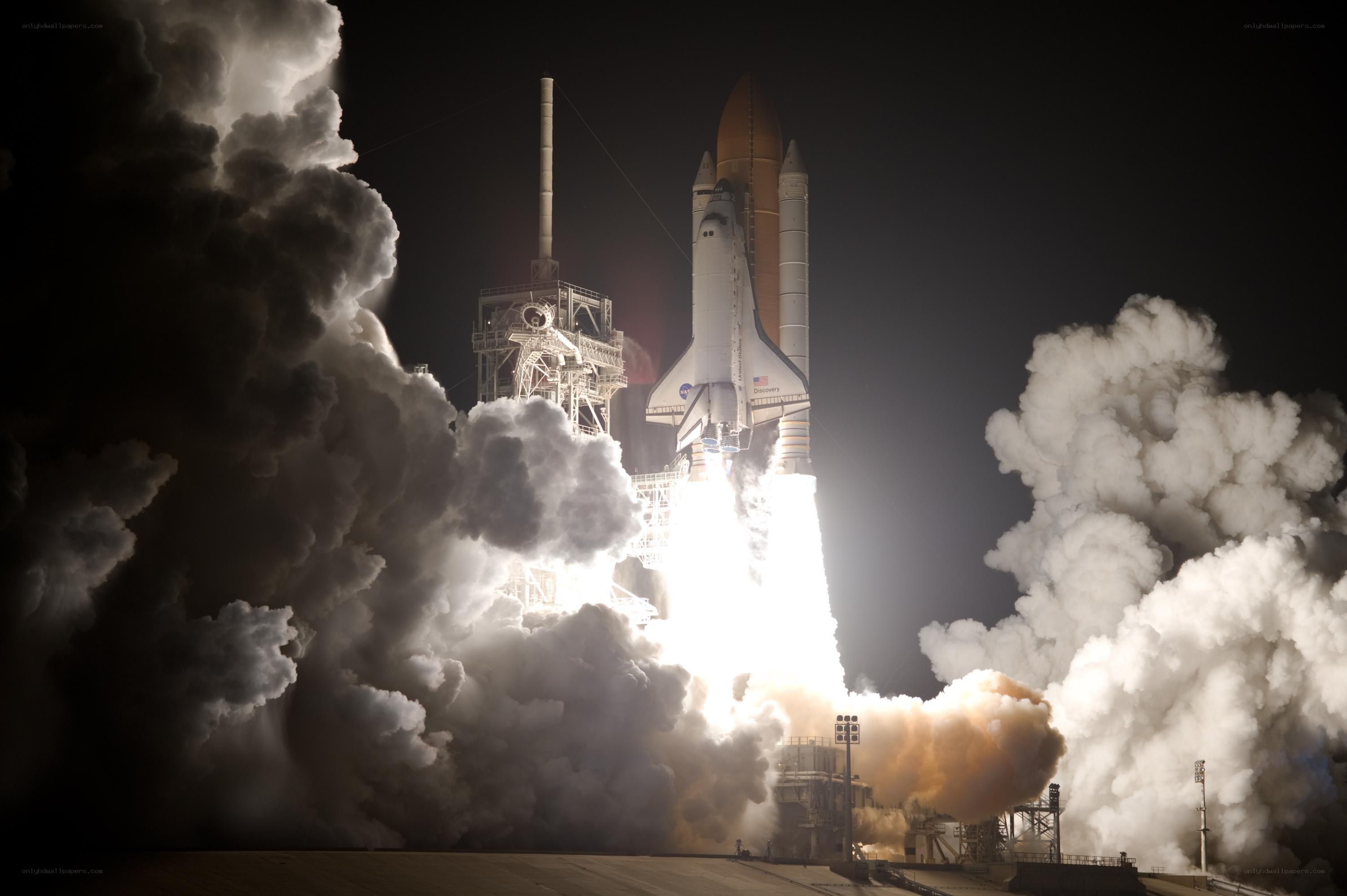 Space shuttle launch at night