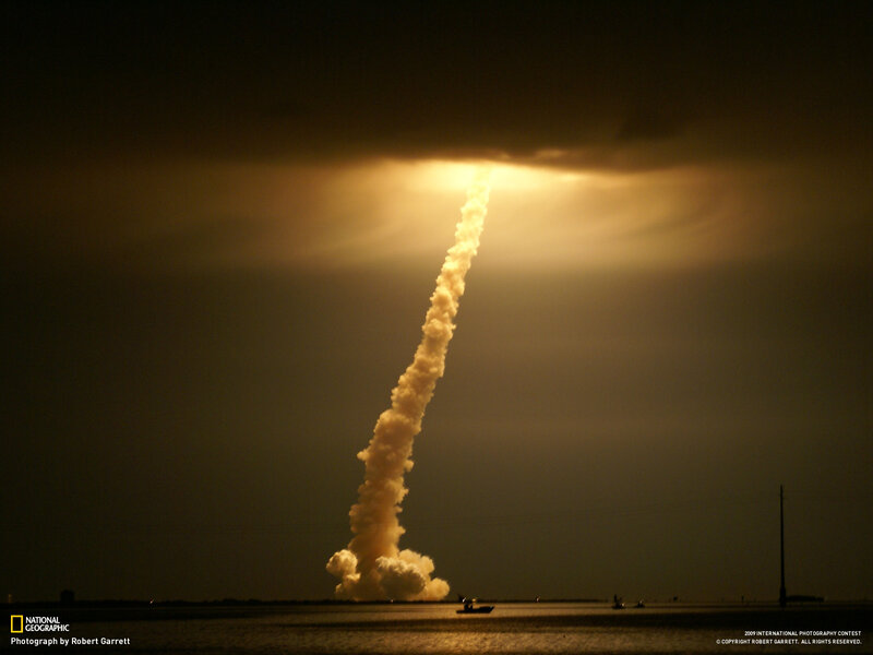 Space shuttle launch at night