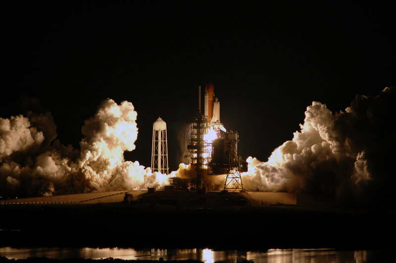 Space shuttle launch at night