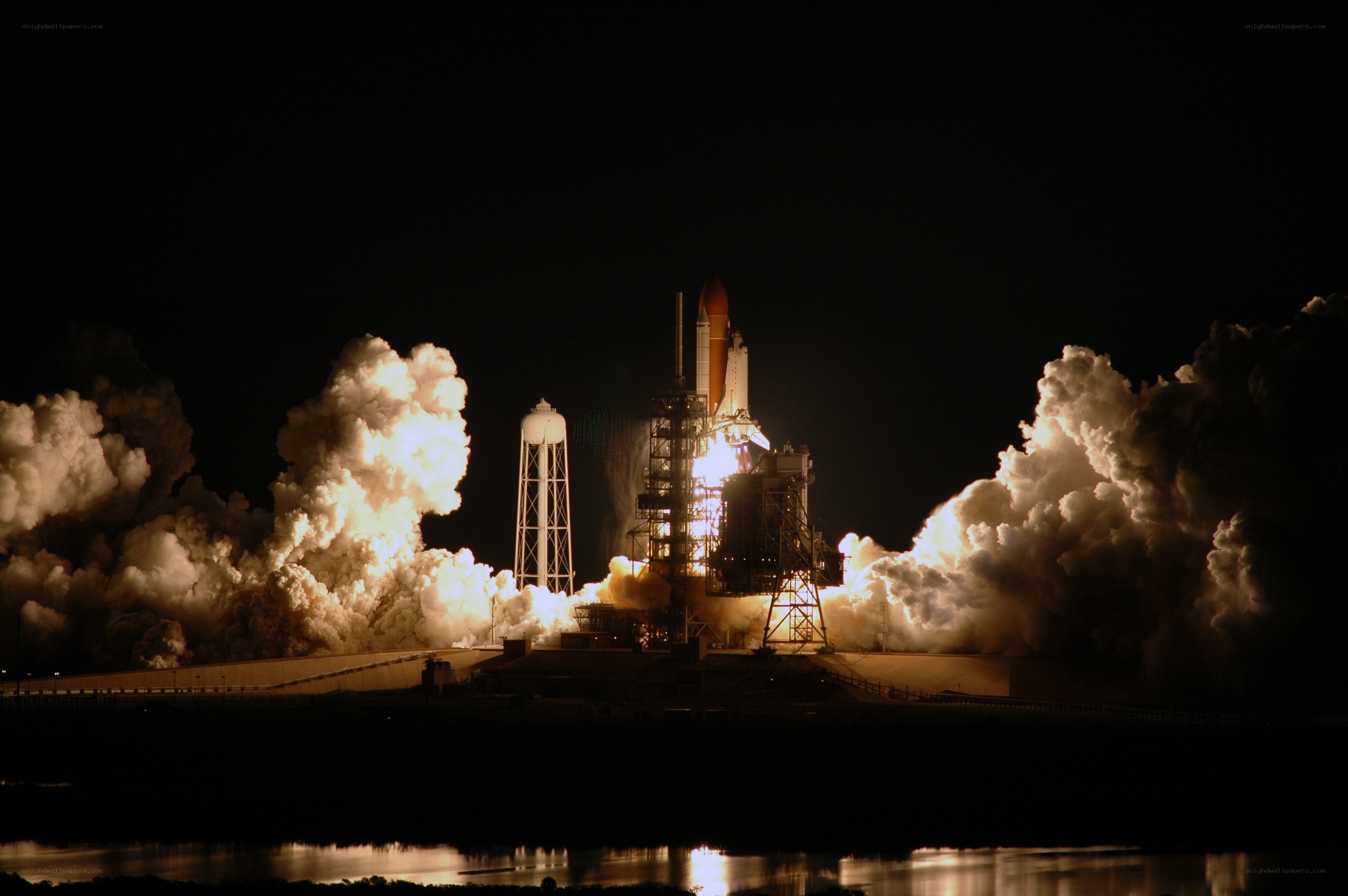 Space shuttle launch at night