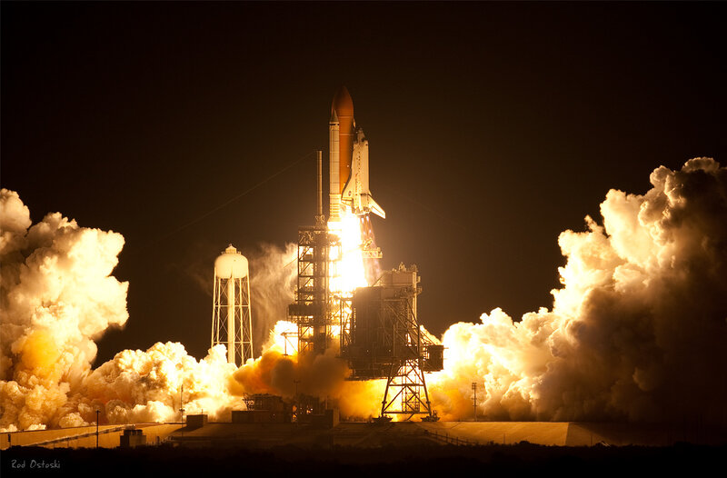 Space shuttle launch at night