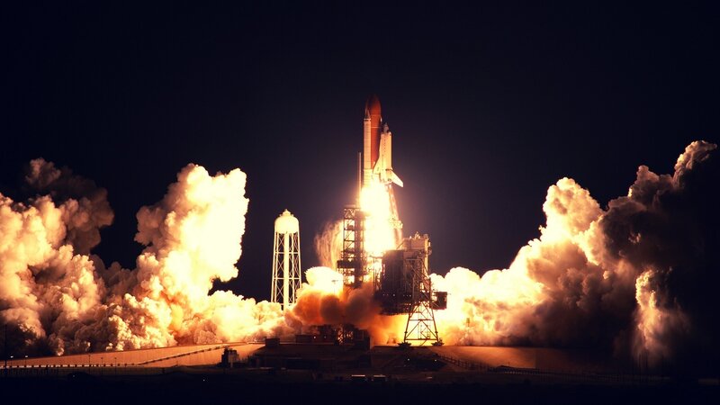 Space shuttle launch at night