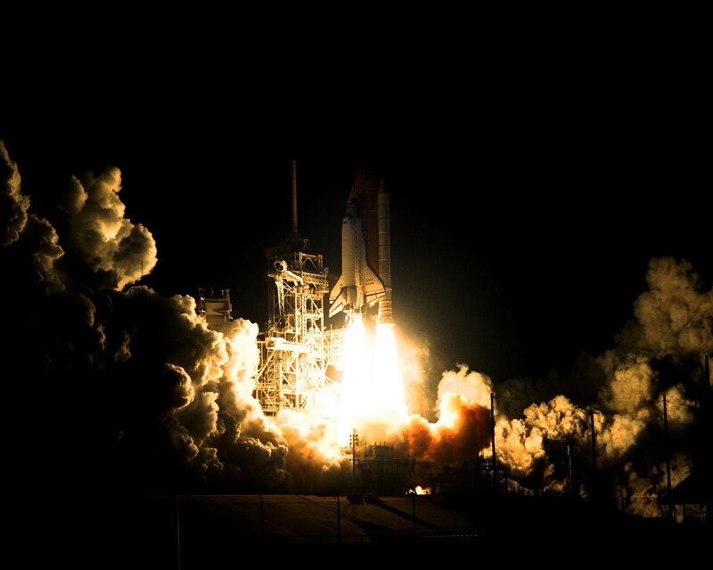 Space shuttle launch at night