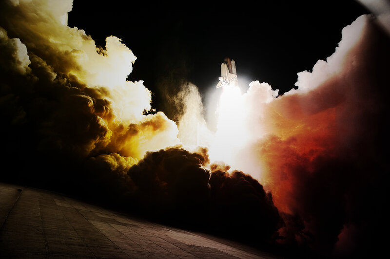 Space shuttle launch at night