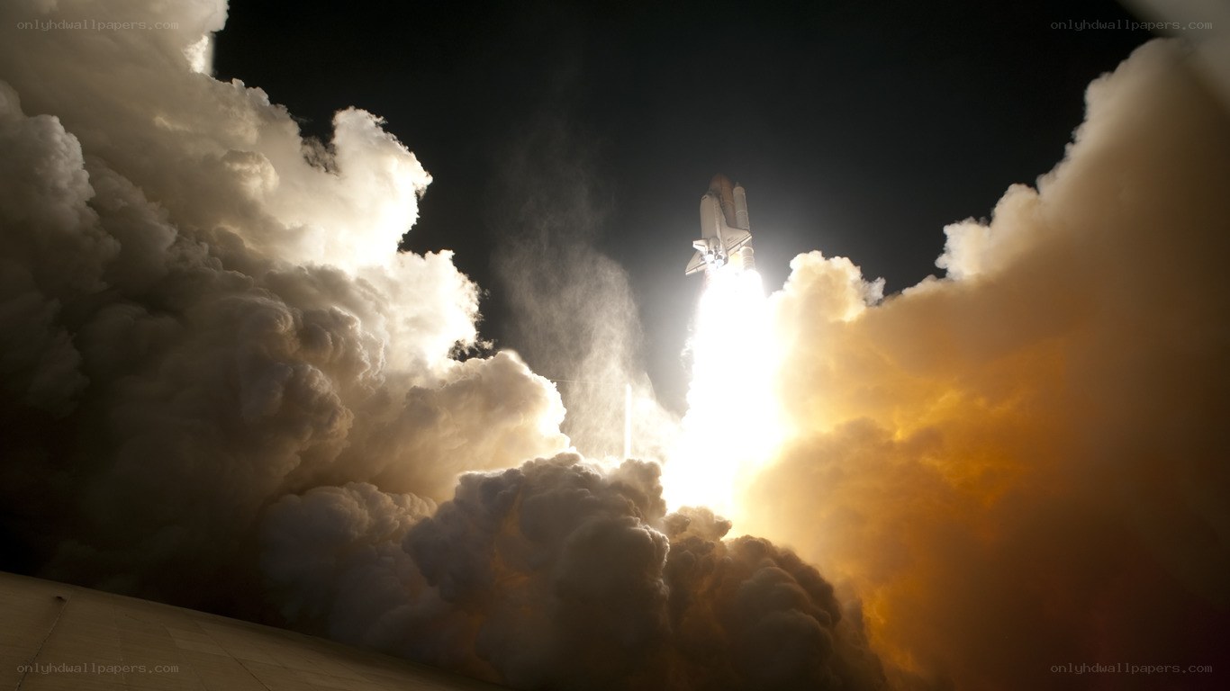 Space shuttle launch at night