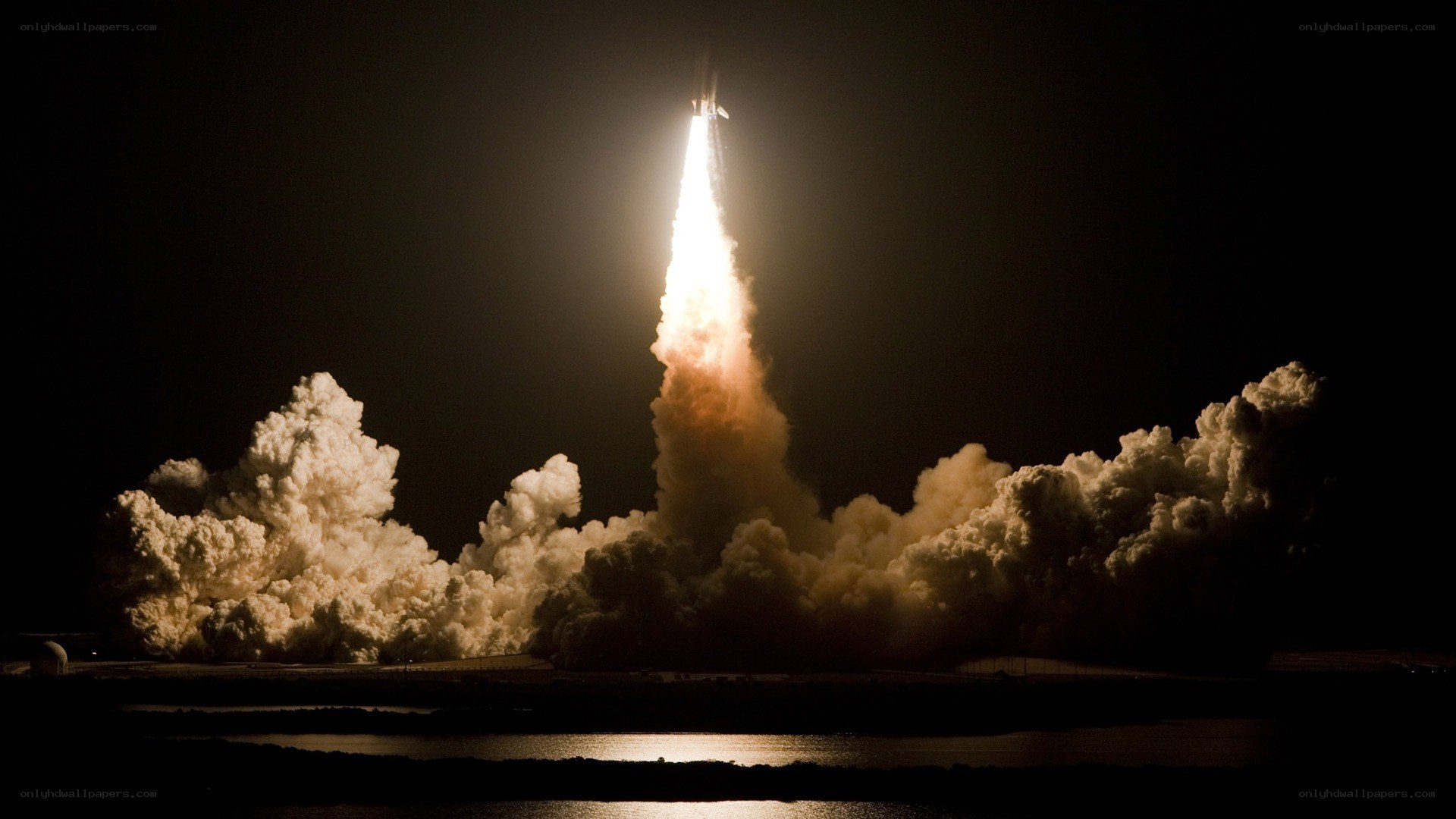 Space shuttle launch at night