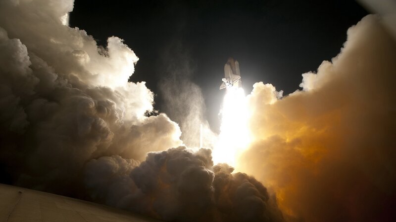 Space shuttle launch at night