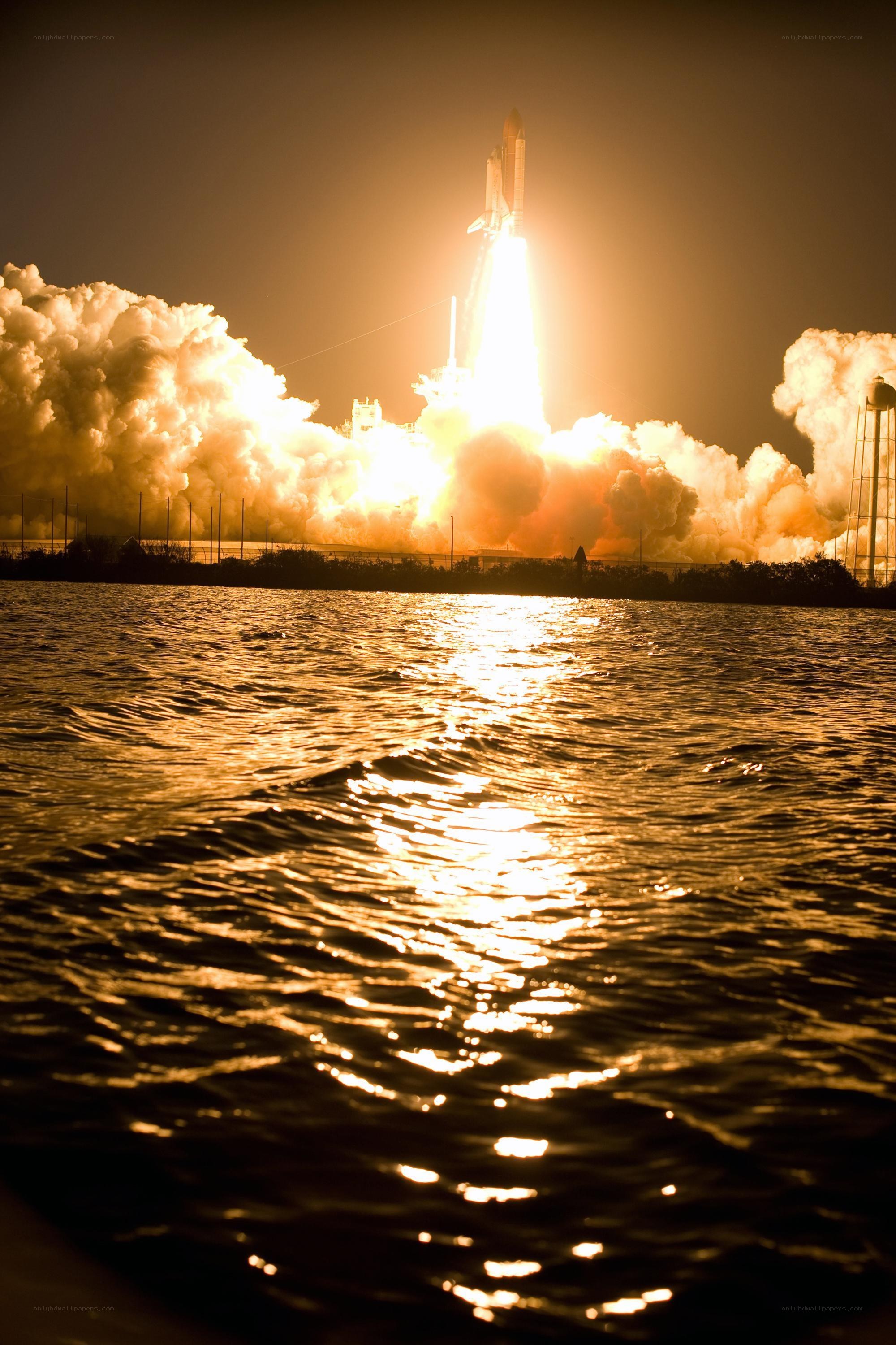 Space shuttle launch at night
