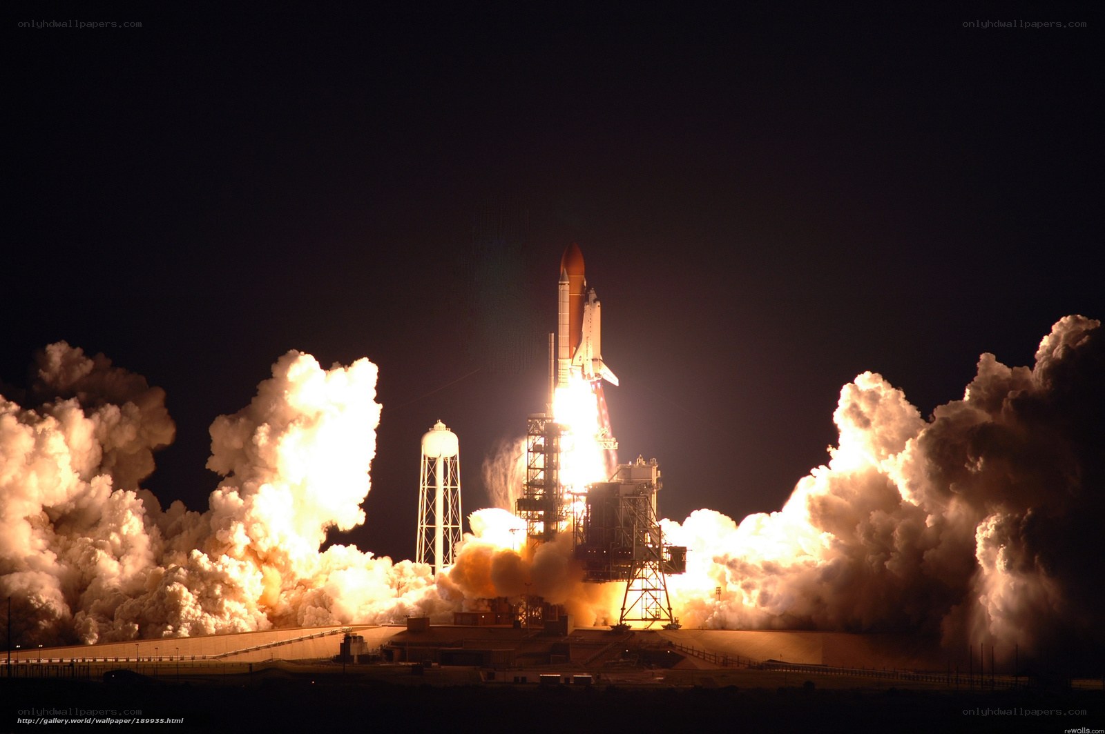 Space shuttle launch at night