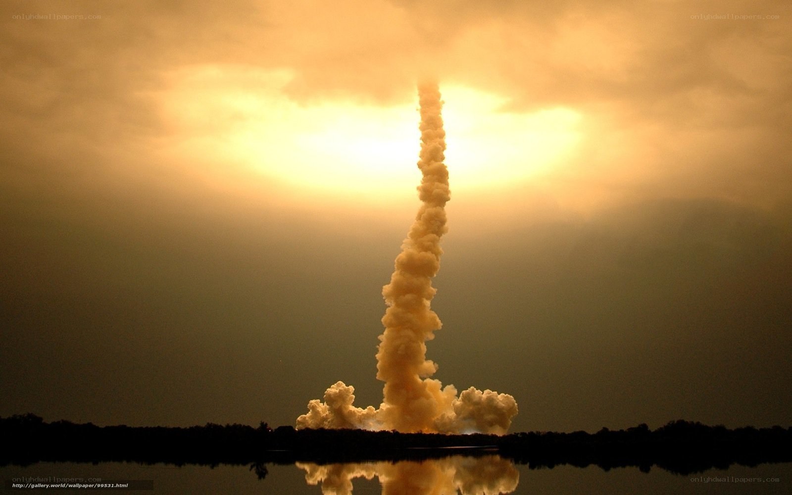 Space shuttle launch at sunset