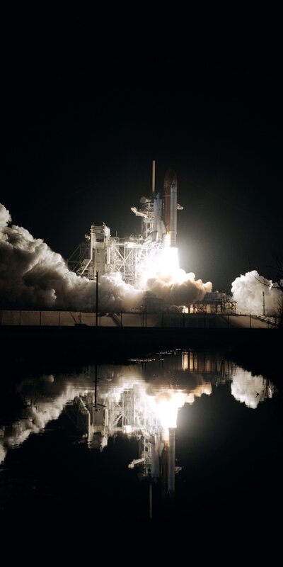 Space Shuttle Launch — Black, Dramatic, Night, Photograph, Rocket, Smoke, Reflection