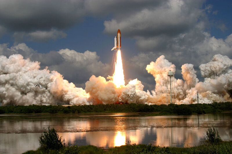 Space Shuttle Launch — Blue, Dramatic, Afternoon, Photograph, Rocket, Clouds, Water Tower, River