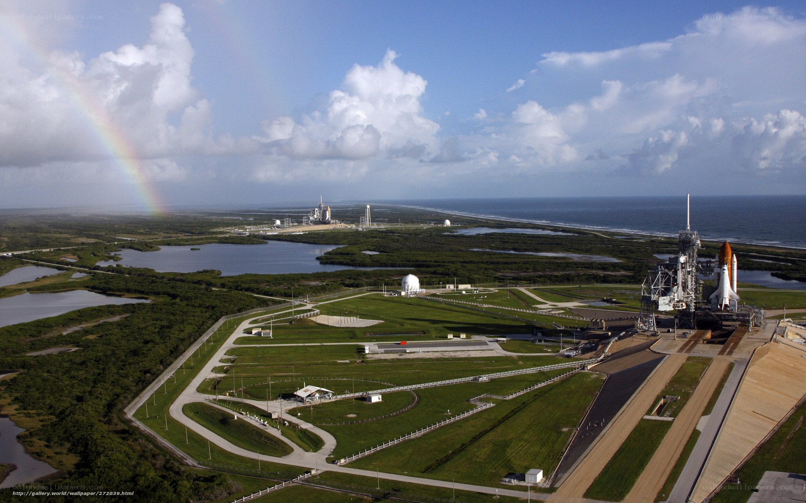 Space shuttle launch site with rainbow