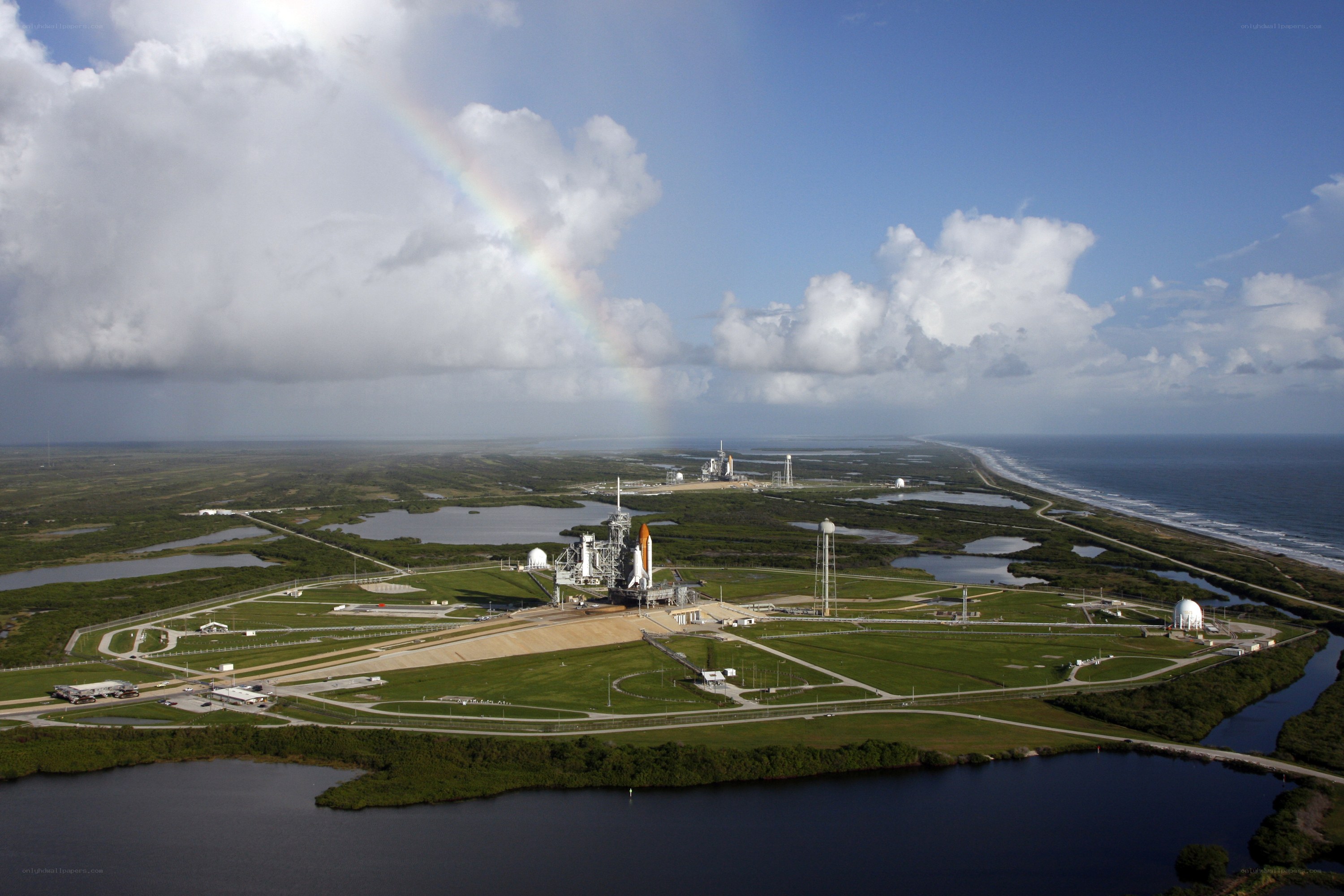 Space shuttle launch site with rainbow