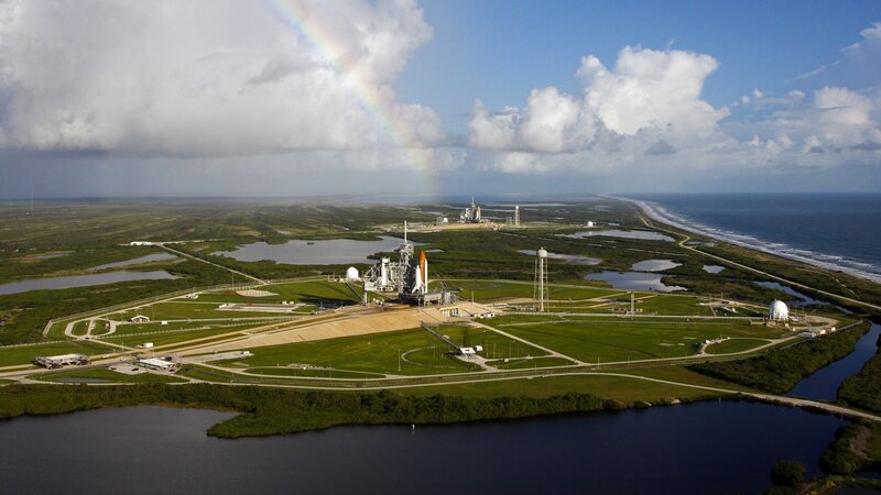 Space shuttle launch site with rainbow