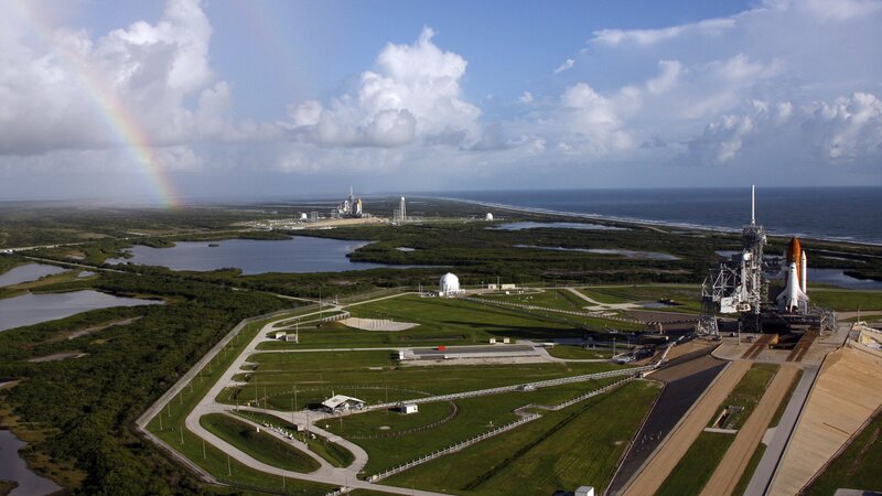Space shuttle launch site with rainbow
