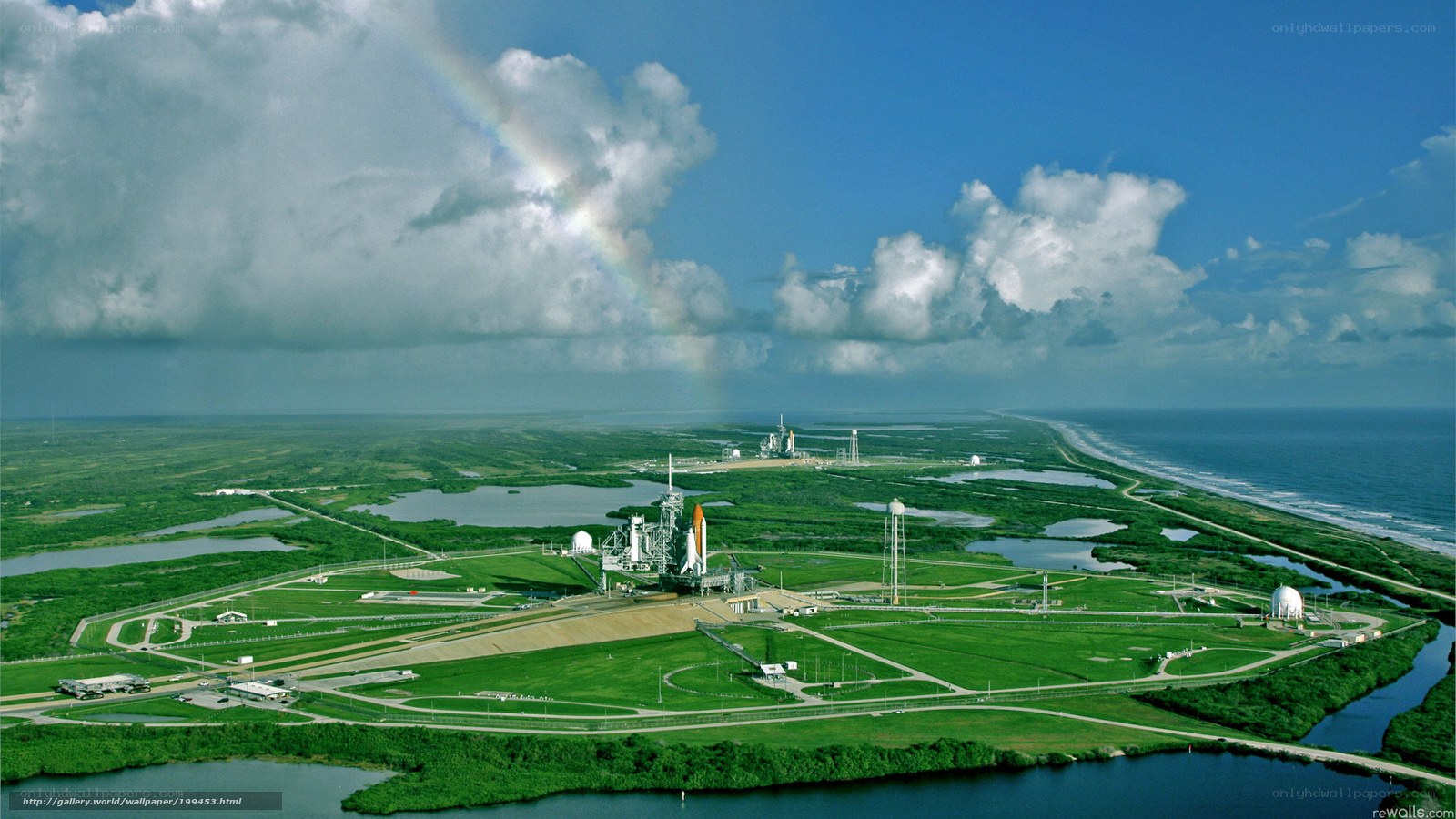 Space shuttle launch site with rainbow