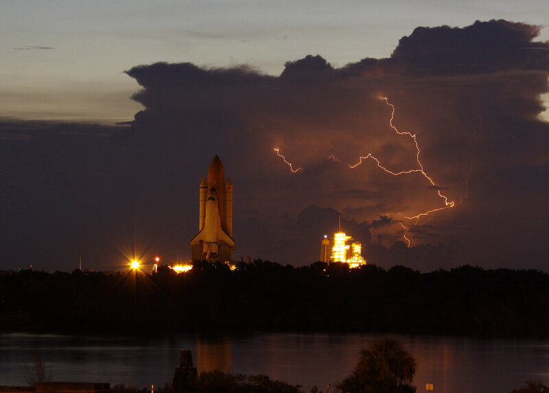 Space shuttle launch with lightning