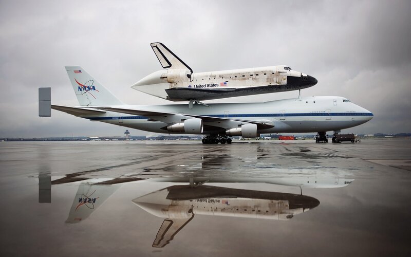 Space Shuttle on Airplane — Gray, Dramatic, Photograph, Reflection