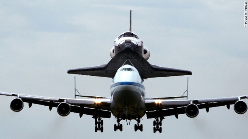 Space Shuttle on Airplane — Gray, Dramatic, Photograph