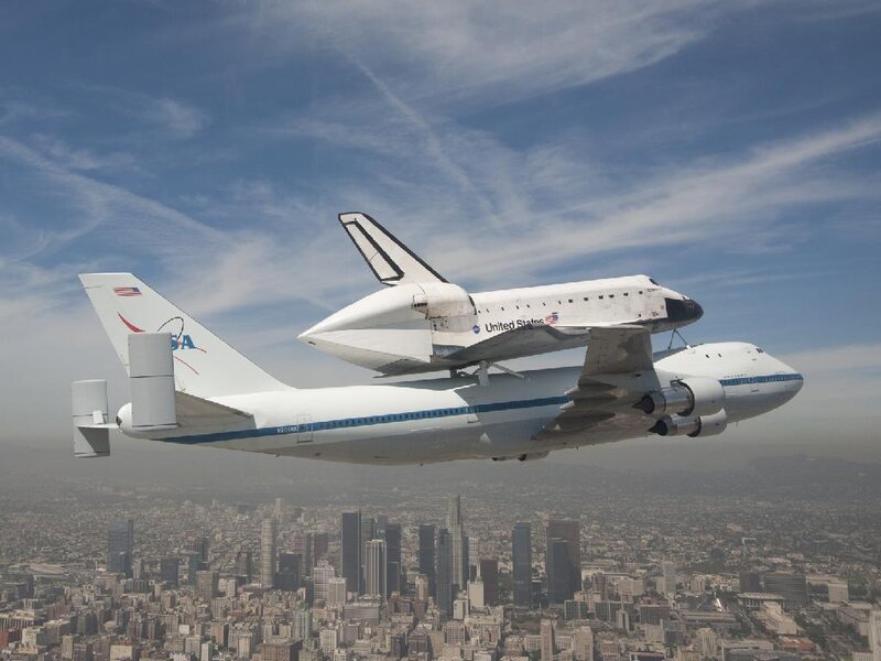 Space Shuttle on Airplane — White, Dramatic, Afternoon, Photograph, City
