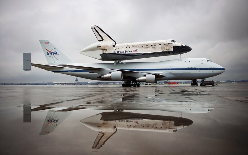 Space Shuttle on Airplane — White, Dramatic, Photograph, Runway
