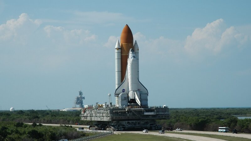 Space Shuttle on Launch Pad — Blue, Calm, Afternoon, Photograph, Launch Tower