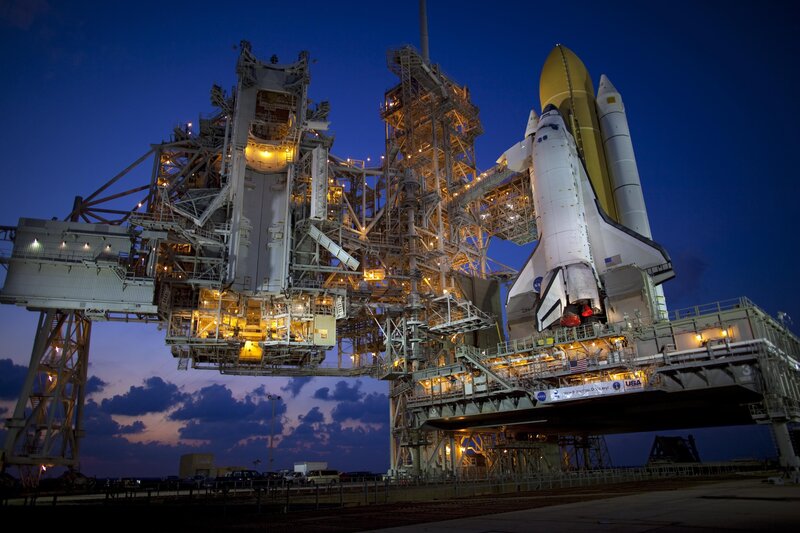 Space Shuttle on Launch Pad — Blue, Dramatic, Night, Photograph, Launch Tower, Solid Rocket Boosters, External Tank