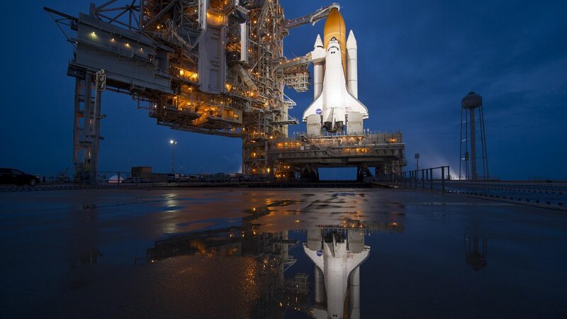 Space Shuttle on Launch Pad — Blue, Dramatic, Night, Photograph, Launch Tower, Water Tower