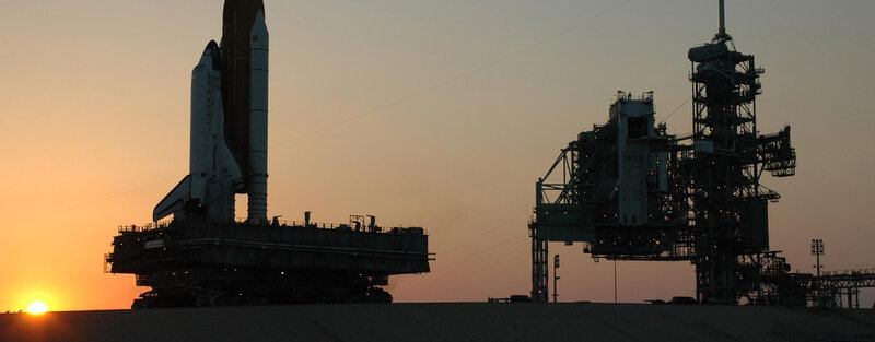 Space Shuttle on Launch Pad — Orange, Dramatic, Sunset