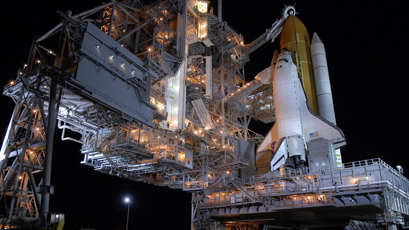 Space Shuttle on Launch Pad — White, Dramatic, Night, Photograph, Launch Tower, Solid Rocket Boosters